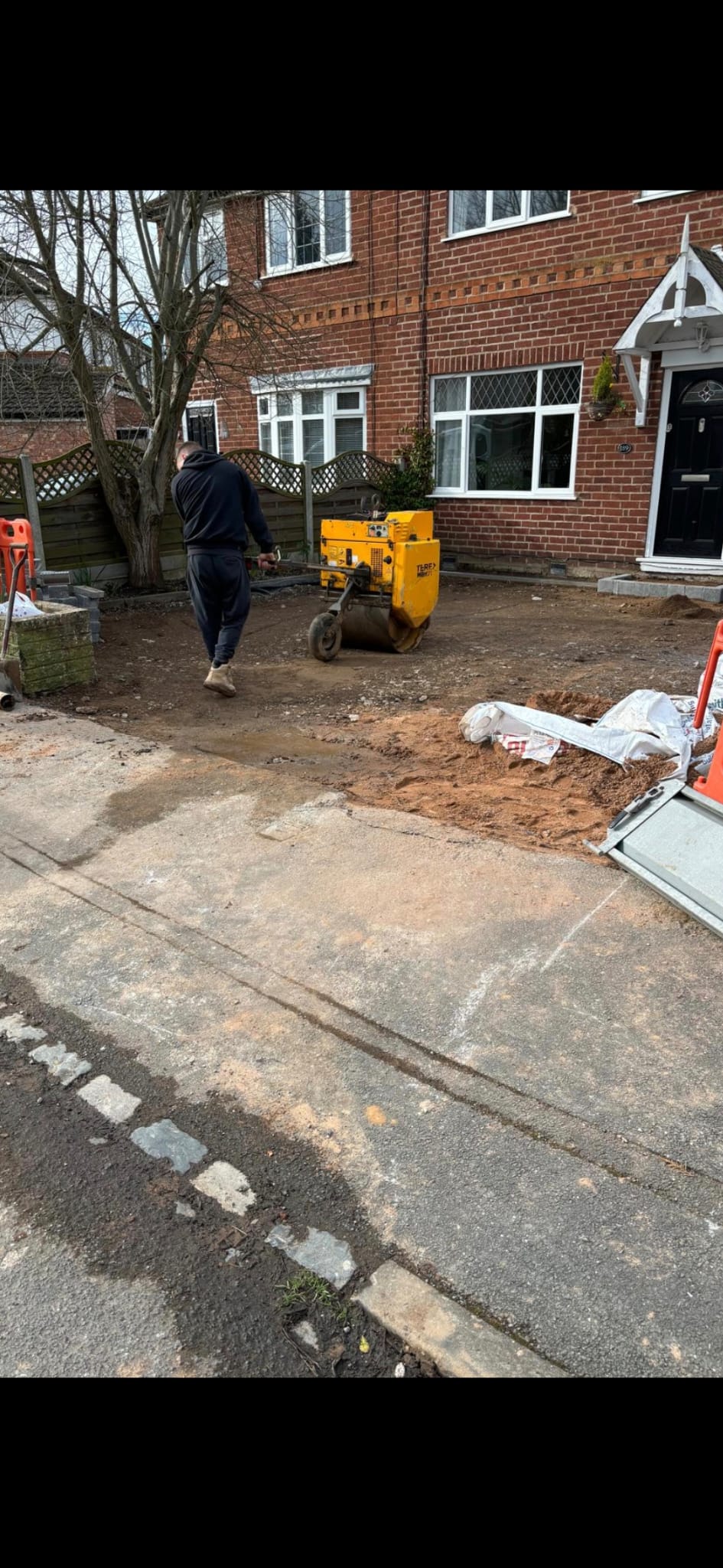 Old drive removed, new gravel with paved border — before